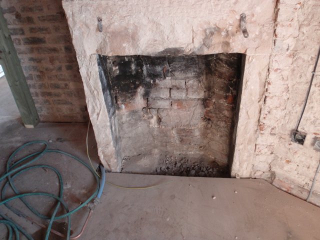 bedroomfireplaceclearedoutreadyfornewfire.jpg